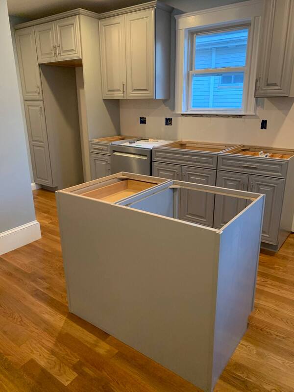 Cabinet installation and kitchen island construction