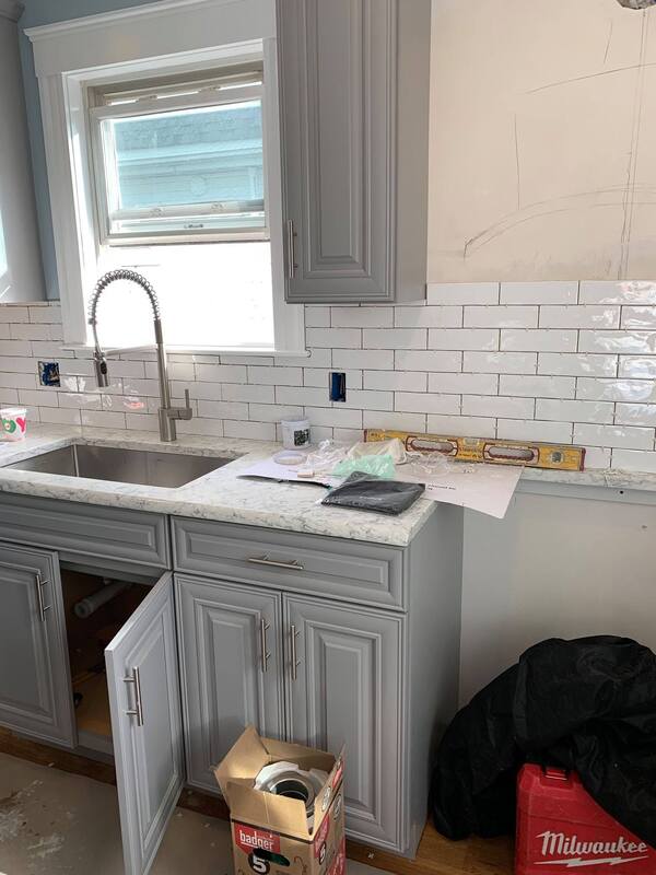 New marble countertop and kitchen sink and fixtures installed