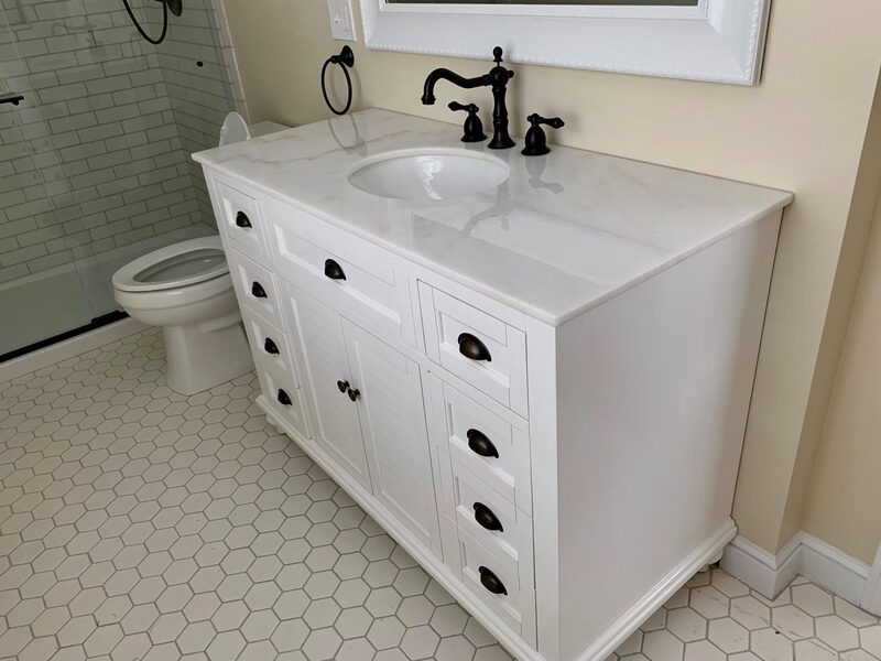 New white bathroom vanity with black fixtures