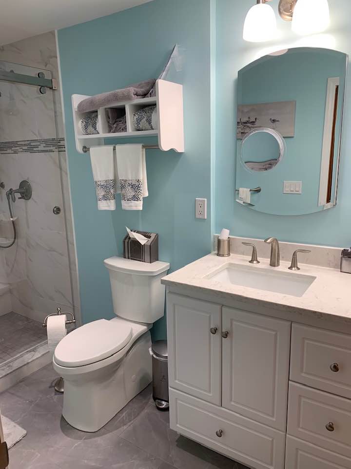 Completely updated bathroom remodel with new paint, shower, vanity and toilet